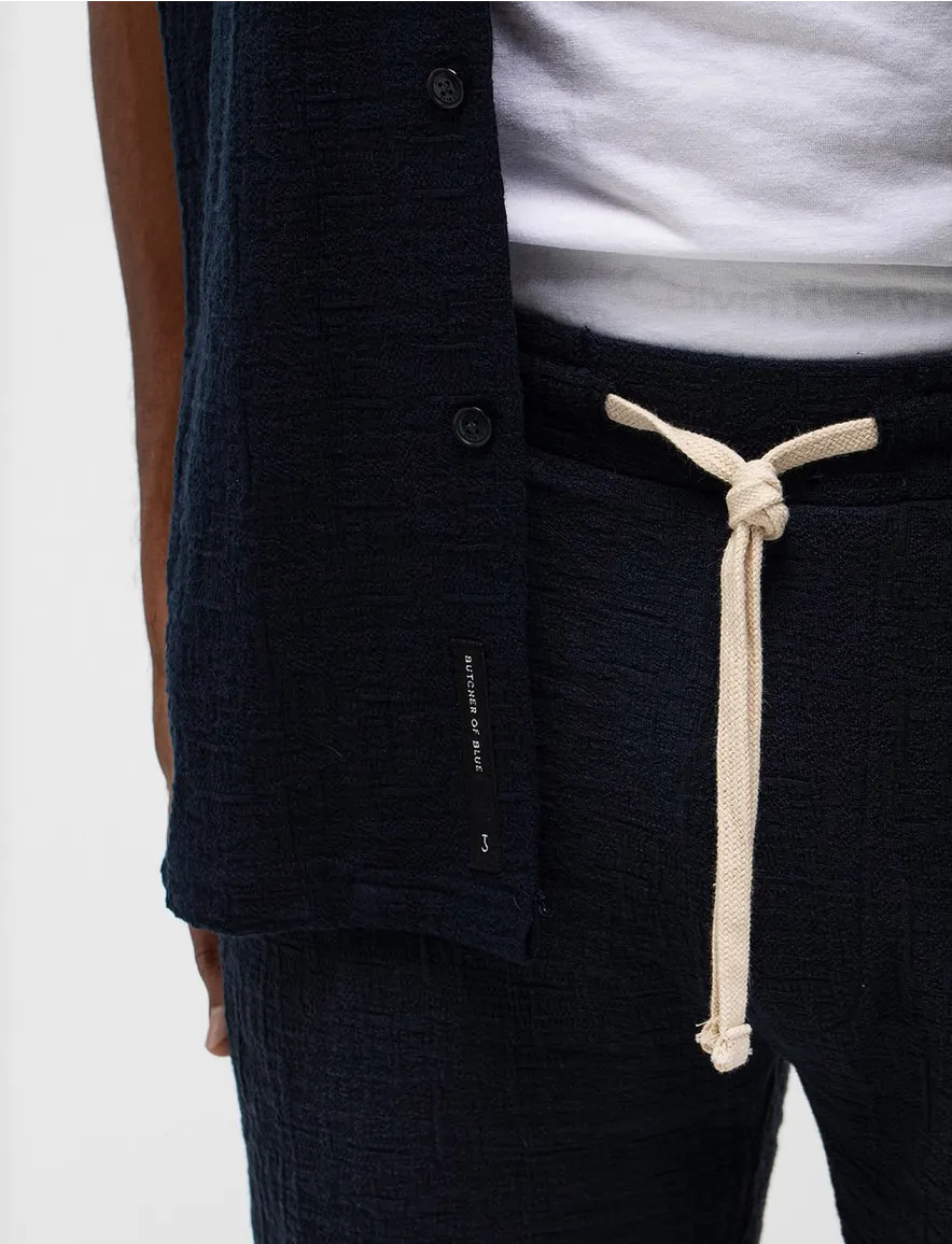 Butcher of Blue polo donkerblauw doorknoop deel van set
