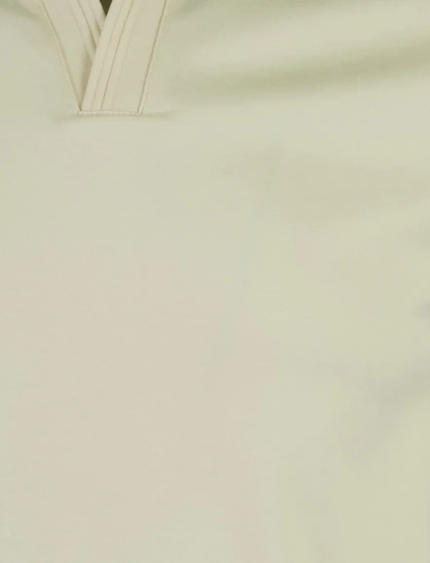 Poloshirt Tommy Hilfiger creme Wijde Fit