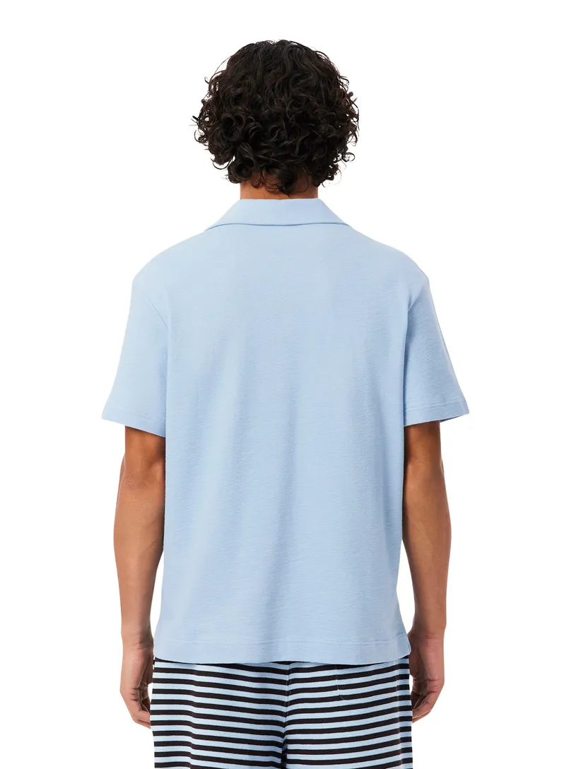Polo Lacoste lichtblauw normale fit 2 knoopjes