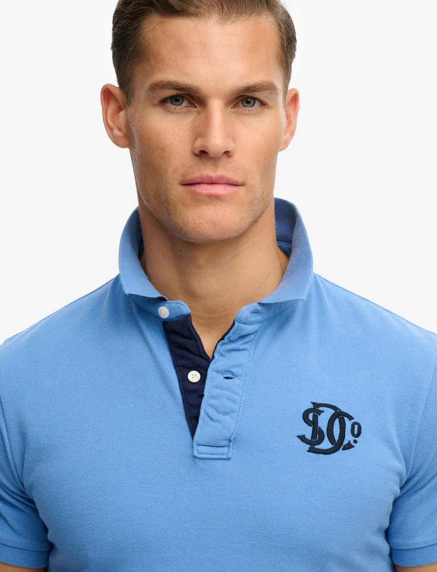 Superdry polo lichtblauw logo borst