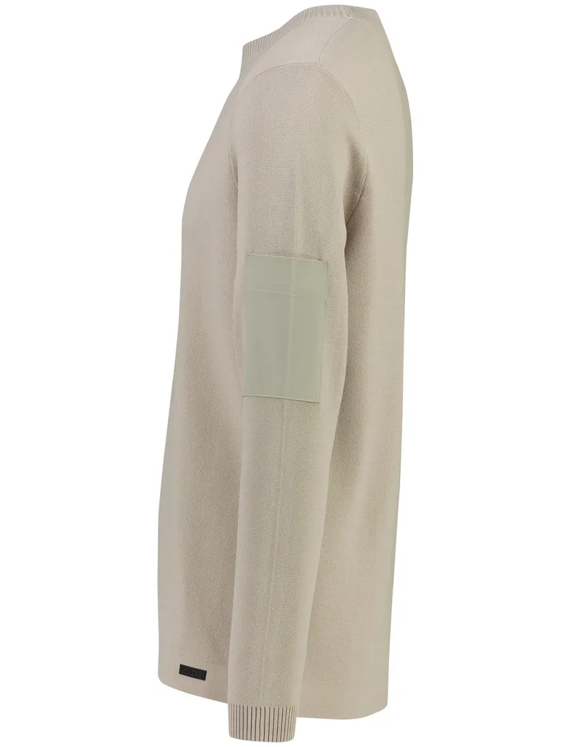 Trui Genti beige zak op de mouw