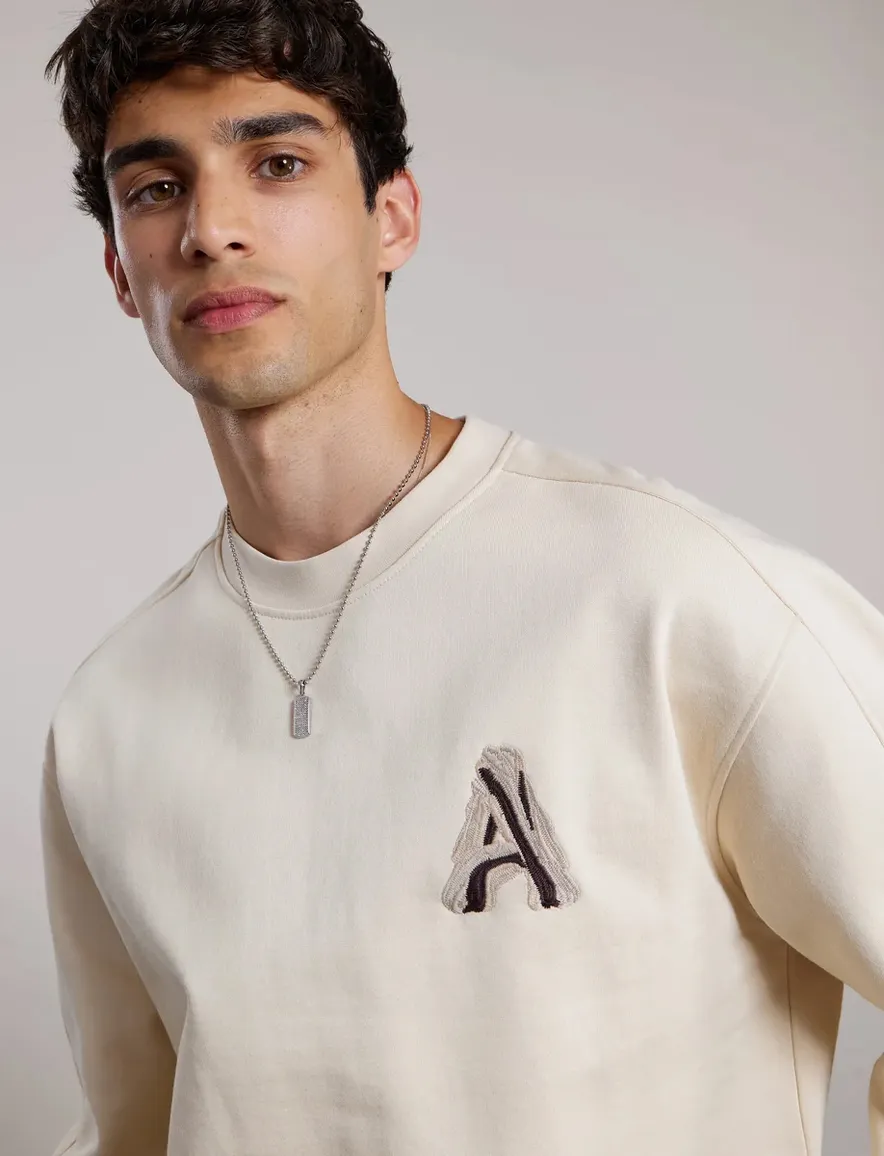 Aeden trui creme backprint oversized