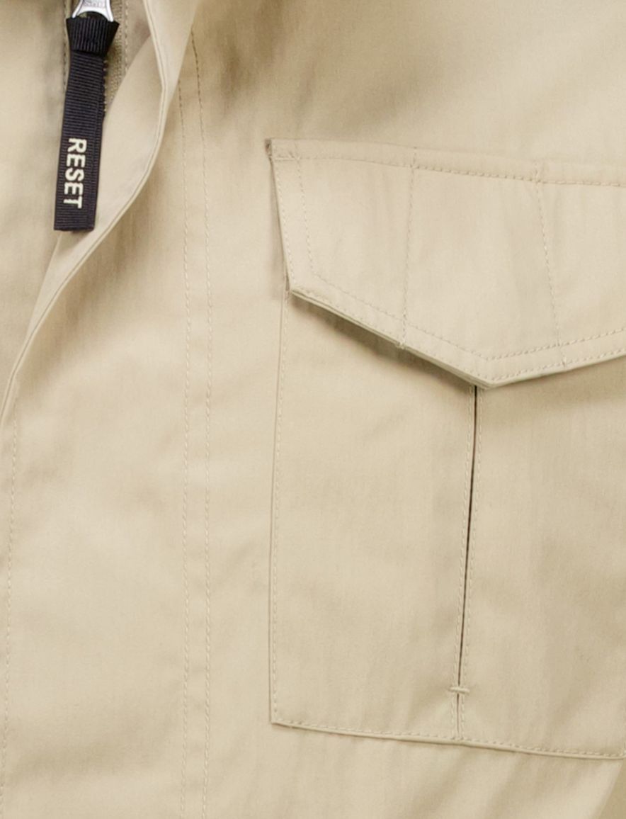 Reset tussenjas beige