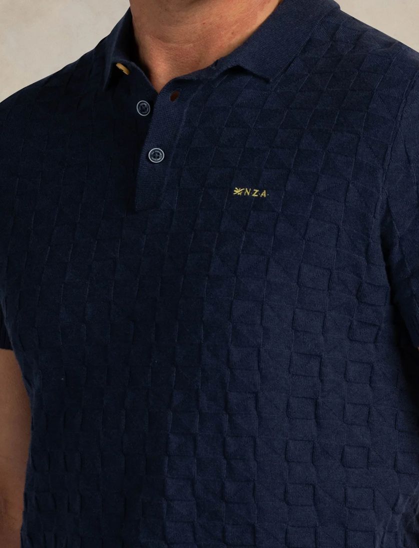 Polo donkerblauw structuur New Zealand Auckland katoen