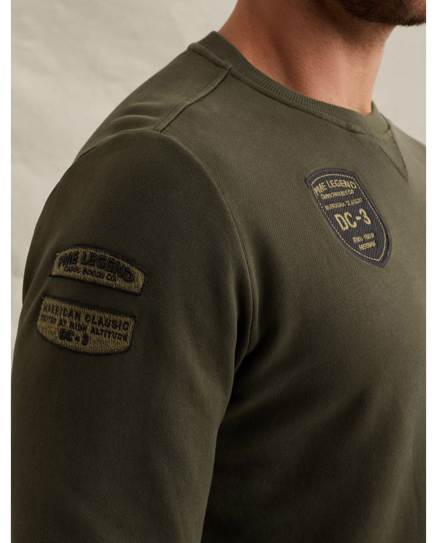 Donkergroene sweater PME Legend embleempjes